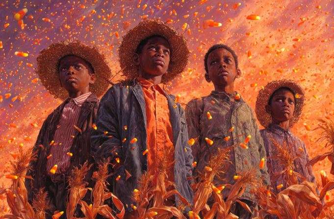 An image of four black boys in a cornfield made of candy corn.