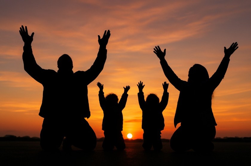 A silhouette of a Black family on their knees in a restaurant parking lot. Their hands are raised to the heavens, rejoicing.
